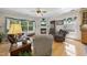 Cozy living room with fireplace, large windows, and comfortable seating at 3207 Imperial Oaks Dr, Raleigh, NC 27614