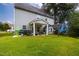 Home's backyard with a patio, pergola, and plenty of space for outdoor living and entertaining at 3401 Grosbeak Way, Raleigh, NC 27616