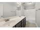 Bathroom showcasing a double sink vanity, large mirror, and a shower-tub combination at 3401 Grosbeak Way, Raleigh, NC 27616