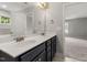 Well-lit bathroom showcasing double sinks and a wide mirror that adds to the room's bright and functional design at 3401 Grosbeak Way, Raleigh, NC 27616