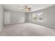Bright bedroom with large windows, ceiling fan, and neutral carpet that provide a comfortable space at 3401 Grosbeak Way, Raleigh, NC 27616