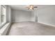Large bedroom boasts a ceiling fan, soft carpet, and a bright window with natural light creating a cozy atmosphere at 3401 Grosbeak Way, Raleigh, NC 27616