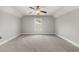 Bedroom featuring carpet, a ceiling fan, and natural light from the window at 3401 Grosbeak Way, Raleigh, NC 27616