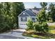 Beautiful two-story home with a well-manicured lawn, blue accents, and attached two-car garage at 3401 Grosbeak Way, Raleigh, NC 27616