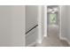 Hallway offering a view of a bedroom with natural light and a ceiling fan at 3401 Grosbeak Way, Raleigh, NC 27616