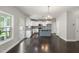 A well-lit kitchen with modern white cabinets, stainless steel appliances, and center island at 3401 Grosbeak Way, Raleigh, NC 27616