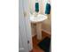 Bathroom with pedestal sink, faucet, dark rug, towel, and towel rack at 3423 Van Hessen Dr, Raleigh, NC 27614