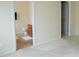 Bedroom view showing doorway into bathroom that has vanity and tile flooring at 3423 Van Hessen Dr, Raleigh, NC 27614