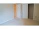 Neutral carpeted bedroom featuring a closet and entrance to another room at 3423 Van Hessen Dr, Raleigh, NC 27614