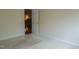Bedroom view showing the neutral carpeted floors, paint color and doorway into another room at 3423 Van Hessen Dr, Raleigh, NC 27614