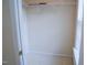 Walk in closet with white wire shelving and neutral carpeting at 3423 Van Hessen Dr, Raleigh, NC 27614