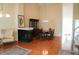 Open-concept dining room area with hardwood floors, fireplace, and dining set at 3423 Van Hessen Dr, Raleigh, NC 27614