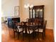 Traditional dining room with hardwood floors, a fireplace, and a dark wood china cabinet at 3423 Van Hessen Dr, Raleigh, NC 27614