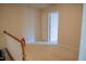 Hallway with beige carpet, neutral walls, and a white door at 3423 Van Hessen Dr, Raleigh, NC 27614