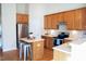 Kitchen with stainless appliances, wood cabinets, center island, and eat-in area at 3423 Van Hessen Dr, Raleigh, NC 27614