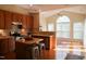 Bright kitchen with wood cabinets, a center island, and stainless steel appliances at 3423 Van Hessen Dr, Raleigh, NC 27614