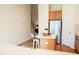 Open concept kitchen featuring a center island, stainless steel refrigerator and eat-in area at 3423 Van Hessen Dr, Raleigh, NC 27614