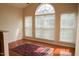 Well-lit living area features hardwood floors and a large window at 3423 Van Hessen Dr, Raleigh, NC 27614