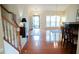 Spacious living room featuring hardwood floors, staircase, and a fireplace at 3423 Van Hessen Dr, Raleigh, NC 27614