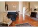 Open-concept living room with hardwood floors and staircase at 3423 Van Hessen Dr, Raleigh, NC 27614