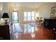 Spacious living room featuring hardwood floors, large windows, and a fireplace at 3423 Van Hessen Dr, Raleigh, NC 27614