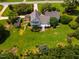 Aerial view of a well-maintained home with a sprawling backyard and mature trees, a private retreat at 3619 Nc-57, Hillsborough, NC 27278