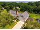 Beautiful home featuring mature trees, a spacious yard with a wooden pergola, and a two-car garage at 3619 Nc-57, Hillsborough, NC 27278
