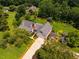 Charming home with lush landscaping, wooden pergola, shed and expansive yard surrounded by mature trees at 3619 Nc-57, Hillsborough, NC 27278