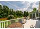 Expansive back deck ideal for outdoor entertaining, with green scenery, and a sunroom at 3619 Nc-57, Hillsborough, NC 27278