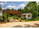 Charming backyard with a pergola and storage shed, perfect for outdoor activities at 3619 Nc-57, Hillsborough, NC 27278