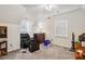 Bedroom with carpeted floors, a ceiling fan, dresser, and windows for natural light at 3619 Nc-57, Hillsborough, NC 27278