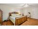 Spacious bedroom with hardwood floors, a decorative headboard, and a cozy, bright aesthetic at 3619 Nc-57, Hillsborough, NC 27278