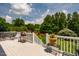 Enjoy outdoor living on this deck with a grill and a view of the lush green yard at 3619 Nc-57, Hillsborough, NC 27278