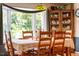 Close up of dining room featuring a vintage hutch and bright bay window at 3619 Nc-57, Hillsborough, NC 27278