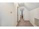 Hallway with carpeted floors, doors, and access to other rooms in the house at 3619 Nc-57, Hillsborough, NC 27278