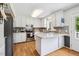 Modern kitchen features white cabinetry, granite countertops, and stainless steel appliances at 3619 Nc-57, Hillsborough, NC 27278