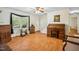 Bright living room with hardwood floors, stairs to the second floor, and a large window at 3619 Nc-57, Hillsborough, NC 27278
