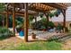 Inviting outdoor space with a pergola, featuring lush plantings and comfortable seating at 3619 Nc-57, Hillsborough, NC 27278