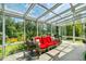 Bright sunroom with abundant natural light, comfortable seating, and scenic views at 3619 Nc-57, Hillsborough, NC 27278