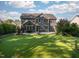 Expansive backyard with lush lawn and manicured landscaping at 3624 Regent Pines Dr, New Hill, NC 27562