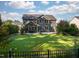 Beautiful backyard with well-manicured lawn and landscape at 3624 Regent Pines Dr, New Hill, NC 27562