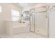 Spacious bathroom with a soaking tub and glass-enclosed shower at 3624 Regent Pines Dr, New Hill, NC 27562
