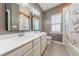 Elegant bathroom featuring double sinks, a tub with shower, and neutral colors for a relaxing atmosphere at 3624 Regent Pines Dr, New Hill, NC 27562