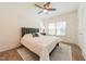 Bright bedroom featuring neutral decor, ceiling fan, and ample natural light through windows at 3624 Regent Pines Dr, New Hill, NC 27562