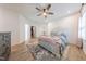Bright bedroom featuring a plush bed, stylish rug, and easy access to a walk-in closet at 3624 Regent Pines Dr, New Hill, NC 27562