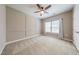 Inviting bedroom with neutral walls, ceiling fan, and carpet with natural light from large windows at 3624 Regent Pines Dr, New Hill, NC 27562