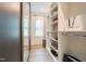 Organized walk-in closet featuring shelving, hanging rods, and plenty of storage space at 3624 Regent Pines Dr, New Hill, NC 27562