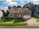 Charming two-story home featuring a manicured lawn, two-car garage and inviting front porch perfect for relaxing at 3624 Regent Pines Dr, New Hill, NC 27562