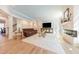 Spacious living room featuring a modern fireplace, lots of natural light and comfortable seating at 3624 Regent Pines Dr, New Hill, NC 27562