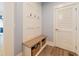 Convenient mudroom with storage bench, hooks, and space for shoes, keeping the home organized at 3624 Regent Pines Dr, New Hill, NC 27562